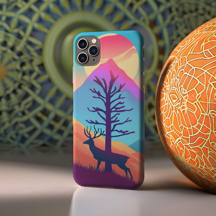 a phone case with a picture of a deer and a tree